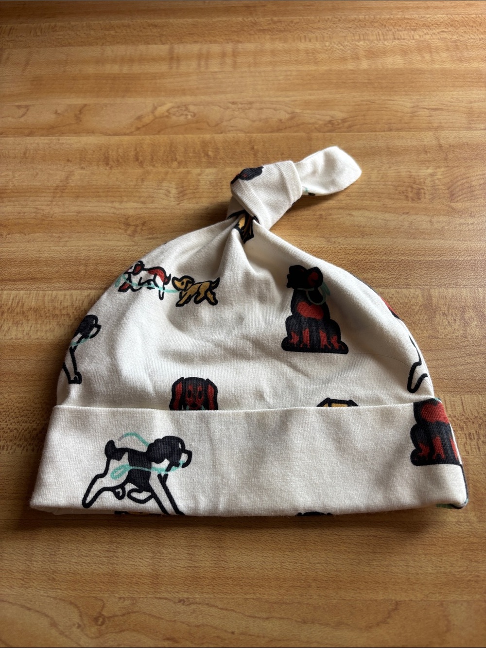 Cream Knot Baby Hat with Playful Dog Print